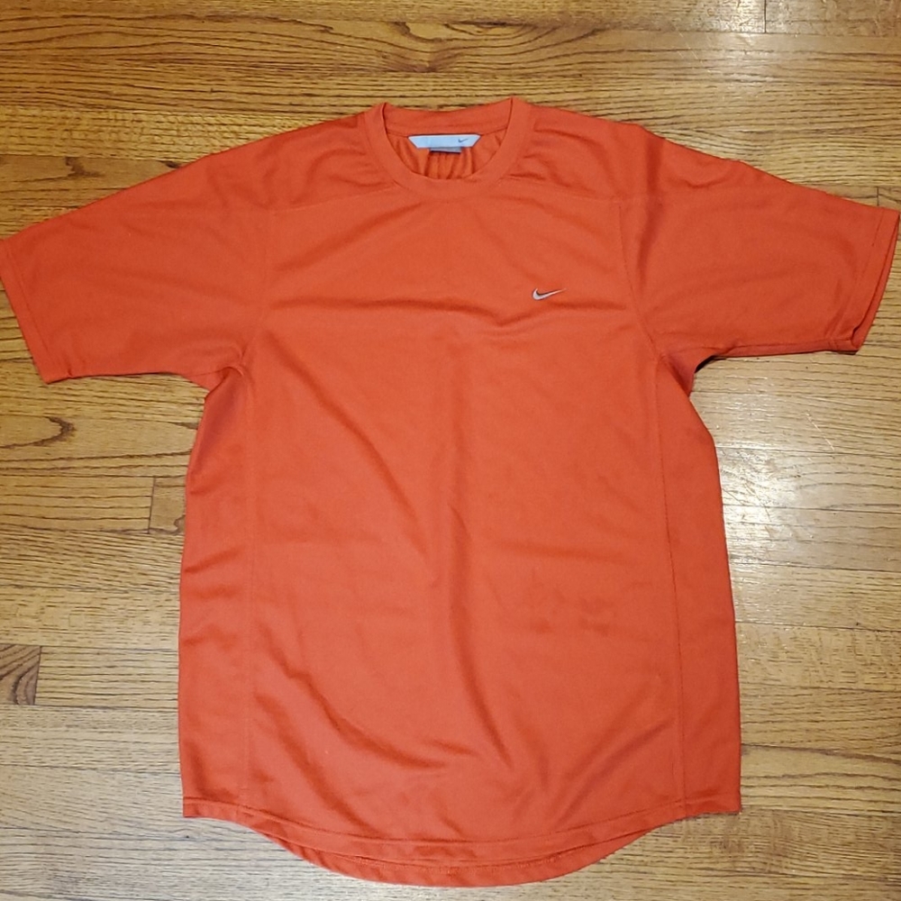 Orange Nike 100% polyester shirt. Size medium